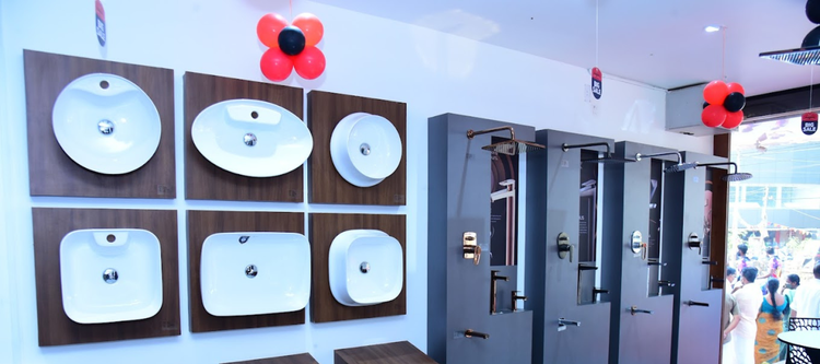 display of various modern sinks mounted on wooden panels in Hardware and electrical shop in Kannur