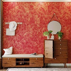 Interior view of a room with a striking red wall and stylish wooden furniture